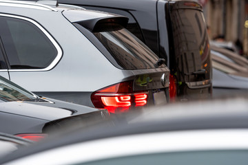 Obraz premium modern cars stands in traffic jam in rush hour