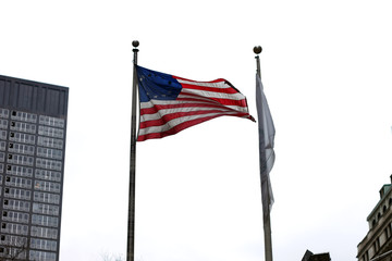 united states flag between buildings