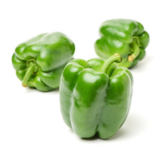 fresh green bell pepper (capsicum) on a white background
