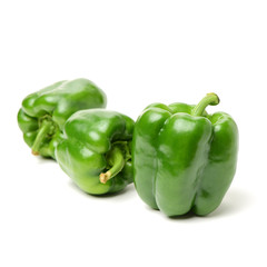 fresh green bell pepper (capsicum) on a white background
