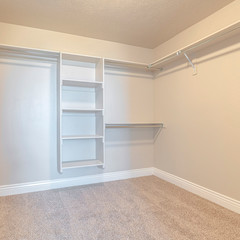 Fototapeta premium Square frame Empty white walk in closet with bare shelving