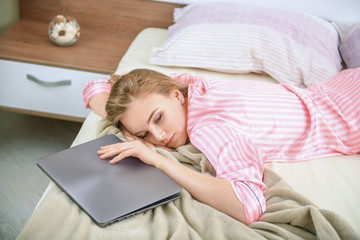 sleepy girl with laptop