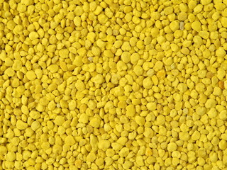 Golden bee pollen granules abstract background