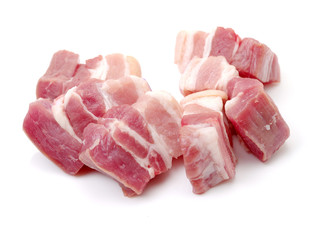 Raw pork belly pieces on a white background