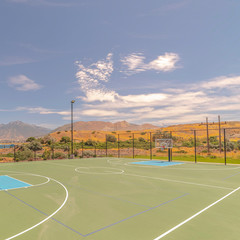 Square frame Outdoor turf basketball court on sunny, clear day