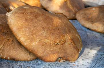 In the village oven, cooked in a wood-fired bread round natural