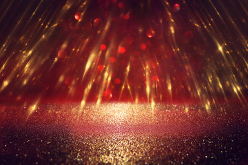 background of abstract glitter lights. gold and black. de focused