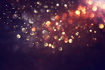 background of abstract glitter lights. gold and black. de focused © tomertu
