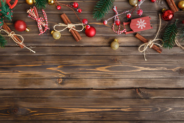 Brown wooden background with festive Christmas decoration, copy space