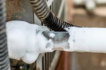 ac cooling air pipes covered by snow or frozen because of super performance of heavy duty central...