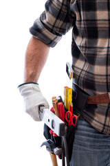Carpenter isolated on a white background, he wears leather work gloves. He is holding the level. Work tools industry construction and do it yourself housework. Stock photography.
