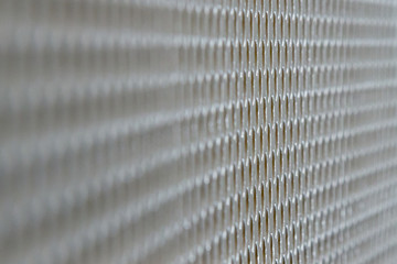 The texture and pattern of perforated metal.