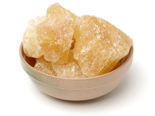 brown crystal sugar on white background