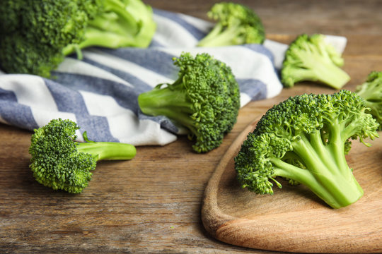 Fresh green broccoli on wooden table. Organic food