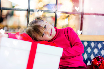 beautiful girl waiting for the opening of gifts