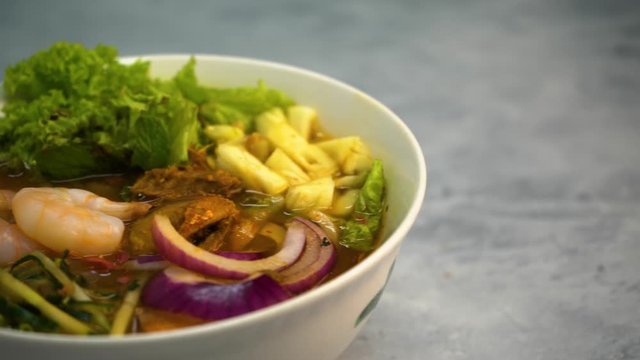 Assam Laksa (Noddle in Tangy Fish Gravy) is a Special Malaysian Food Popular in Penang