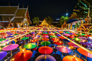 Colorful umbrella and paper vintage lantern for in northern thai style lanterns in Loi Krathong or Yi Peng Festival at Wat Phra Pan (Wat Phra Non Mae Pu Ka) is Buddhist temple in Chiang Mai,Thailand.