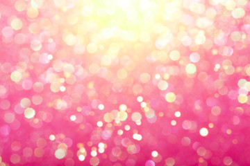 Pink festive background with sparkles in the bokeh. The concept of the celebration, the day of St. Valentine, New Year, birthdays, ceremonies, events, etc.