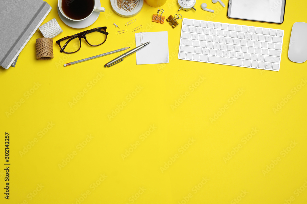 Fototapete flat lay composition with computer accessories and different office items on yellow background, spac