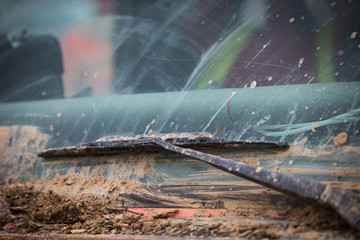 Muddy wind screen of an off road © bizoo_n