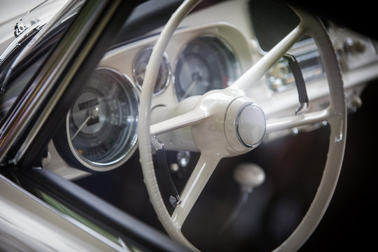White steering wheel of an old classic car