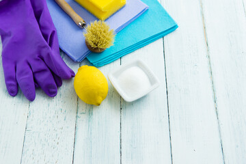 dishwashing tools and citric acid, lemon on white wooden