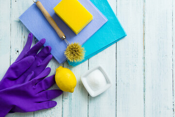 dishwashing tools and citric acid, lemon on white wooden