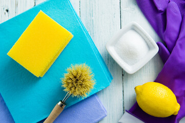 dishwashing tools and citric acid, lemon on white wooden
