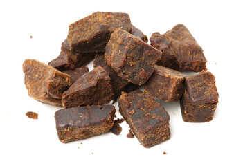 brown cubes of sugar on white background
