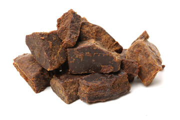 brown cubes of sugar on white background