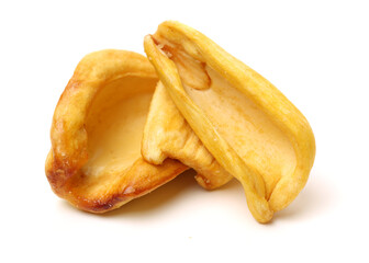 Close up of a pile of dried jackfruit chips isolated on white background