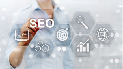 SEO - Search engine optimization, Digital marketing and internet technology concept on blurred background.