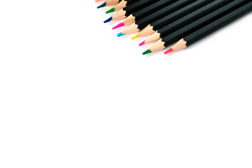 Colored pencils on white isolated background