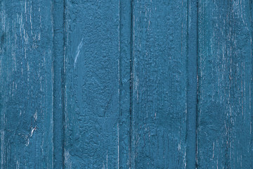 Fototapeta na wymiar Shabby wood texture background. Vintage wooden painted fence. Blue shabby planks, desk surface. Weathered timber. Old boards.