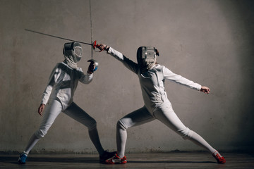 Fencer  with fencing sword. Fencers duel concept. - obrazy, fototapety, plakaty