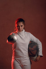 Fencer woman with fencing sword.