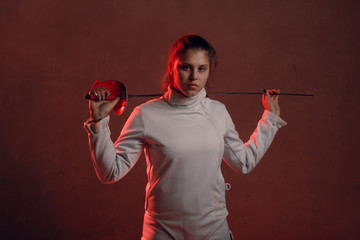 Fencer woman with fencing sword.