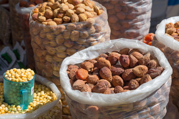 Sacks of dried apricots at the market. Uzbekistan