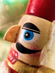 Close up macro photo of a wooden nutcracker christmas ornament