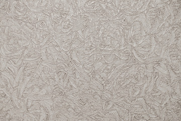 a horizontal neutral beige background with creases