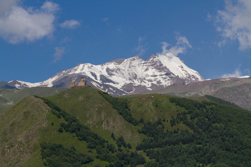 Fototapeta premium View of Gergeti Trinity Church in the Caucasus mountains. Georgia