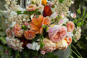 Gorgeous bouquet with colorful flowers in ceramic pot , sunlignt