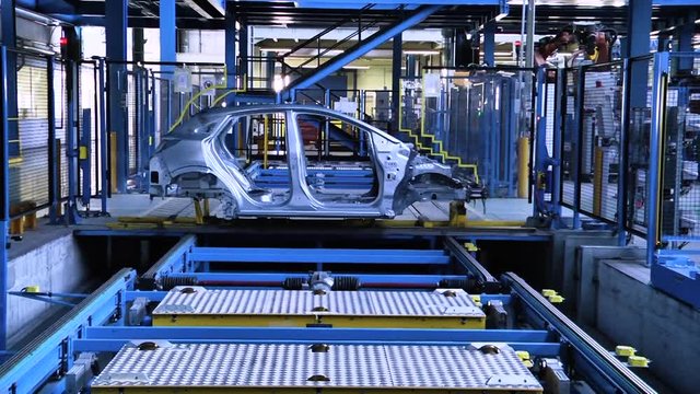 Automobile manufacturing industry. Robots soldering car parts on the production line