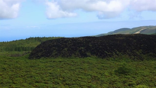 Fields with blue sky and clouds near gruta do Natal in municipality of Praia da Vitoria, on the island of Terceira