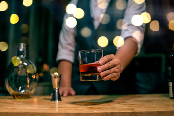 man playing with ball in night club