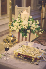 floral wedding decoration in the entrance of church