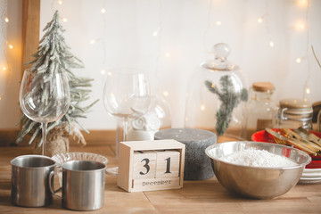 Christmas kitchen decor. Kitchenware on the table. Holiday decorations.