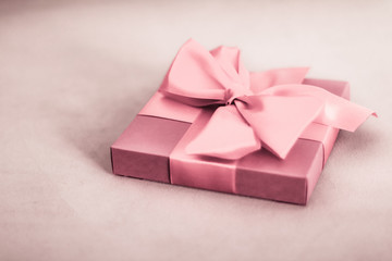 Vintage luxury holiday blush pink gift box with silk ribbon and bow, christmas or valentines day...