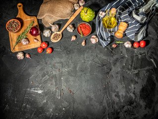 Fresh garlic and spices ingredients spicy food Asian on dark background. Copy space, top view