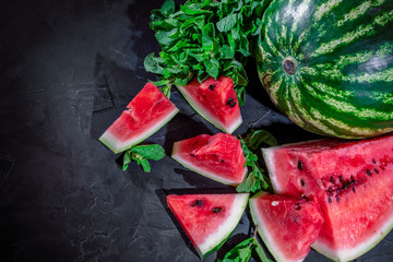 Slices of fresh watermelon on dark background
